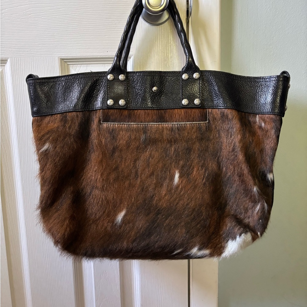 Patricia Nash Brown Haircalf Tote with Black Trim in very good condition.